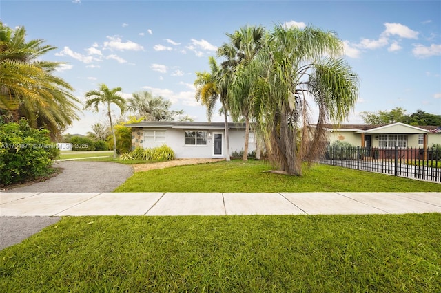 single story home with a front yard