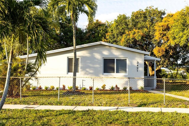 view of home's exterior with a yard