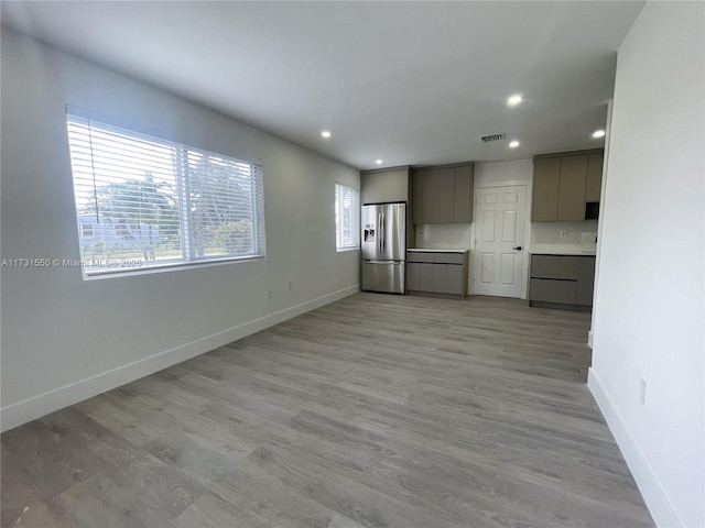 unfurnished living room with light wood-type flooring