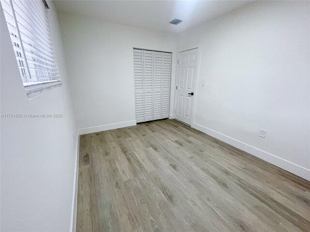 unfurnished bedroom with light hardwood / wood-style flooring