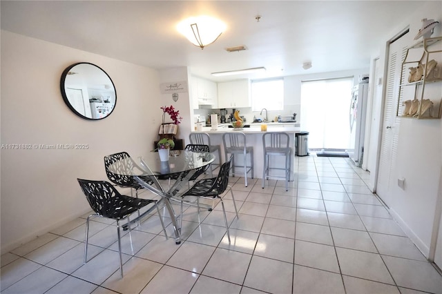 tiled dining space with sink