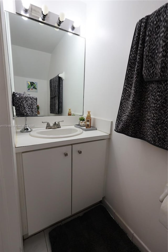 bathroom with vanity and tile patterned flooring