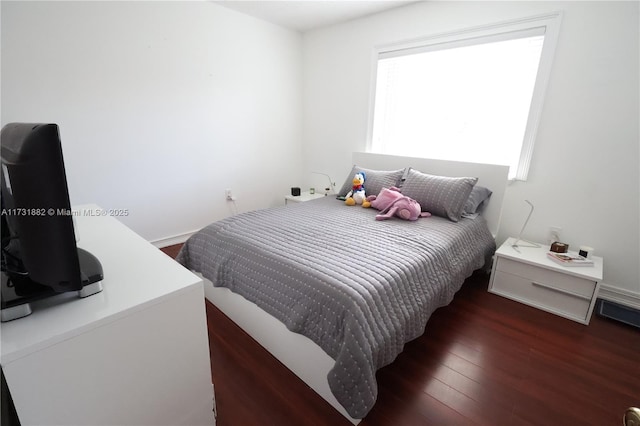 bedroom featuring dark hardwood / wood-style floors