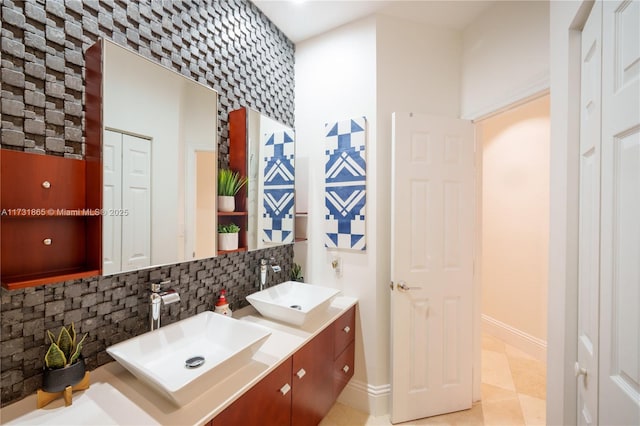 bathroom featuring vanity and decorative backsplash