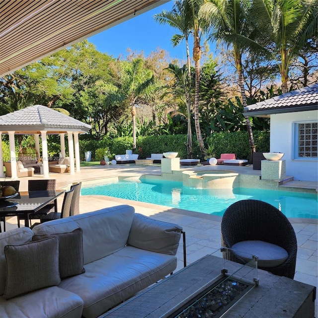 view of swimming pool featuring a gazebo, an outdoor hangout area, a patio area, and an in ground hot tub