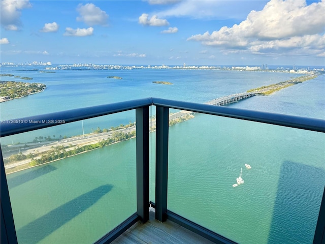 balcony featuring a water view