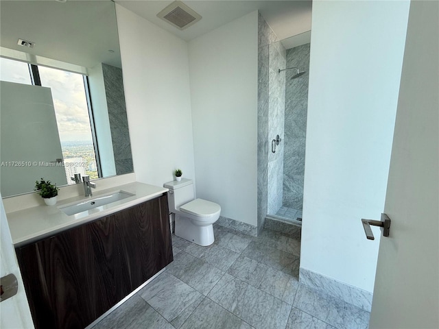full bathroom with a shower stall, toilet, vanity, and visible vents