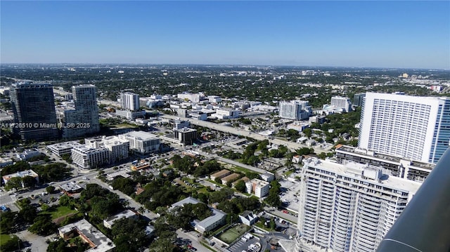 birds eye view of property featuring a city view