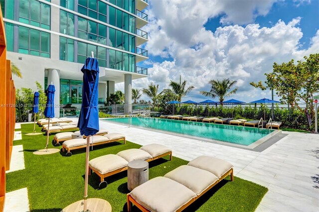 balcony with a patio and a water view