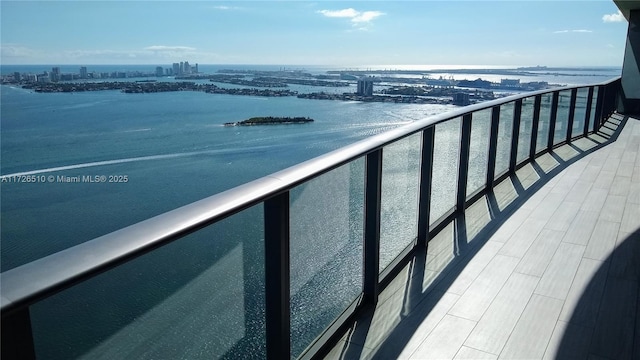balcony with a view of city and a water view