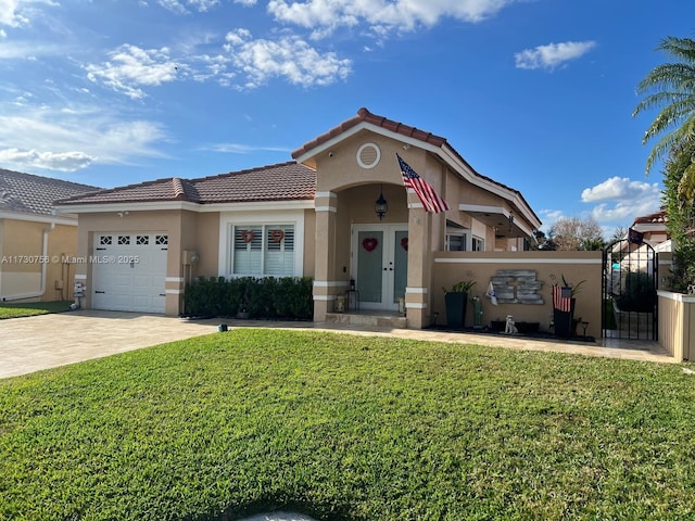 mediterranean / spanish-style house with a garage and a front yard