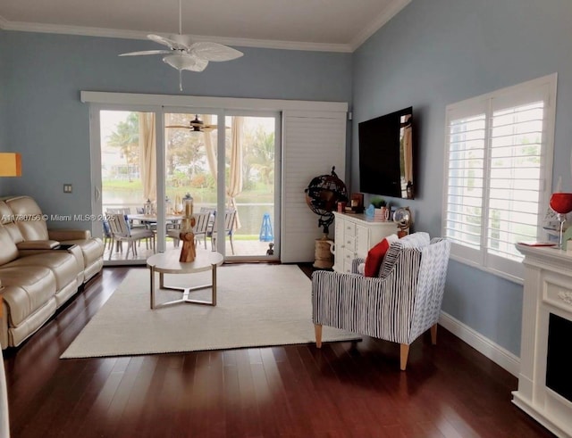 living room featuring ornamental molding, dark hardwood / wood-style floors, and ceiling fan