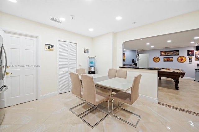 tiled dining room with billiards