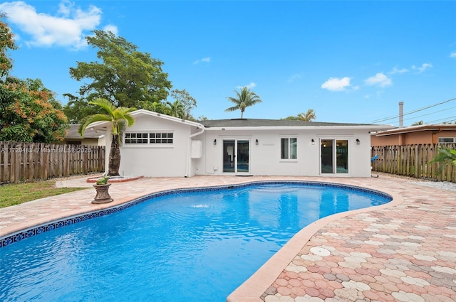 view of swimming pool with a patio