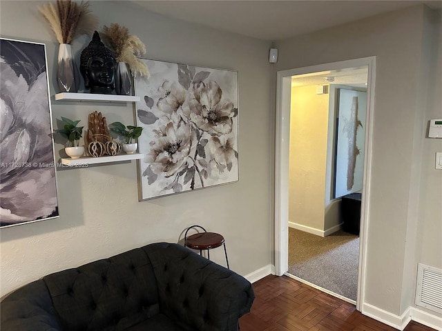 sitting room with dark parquet flooring