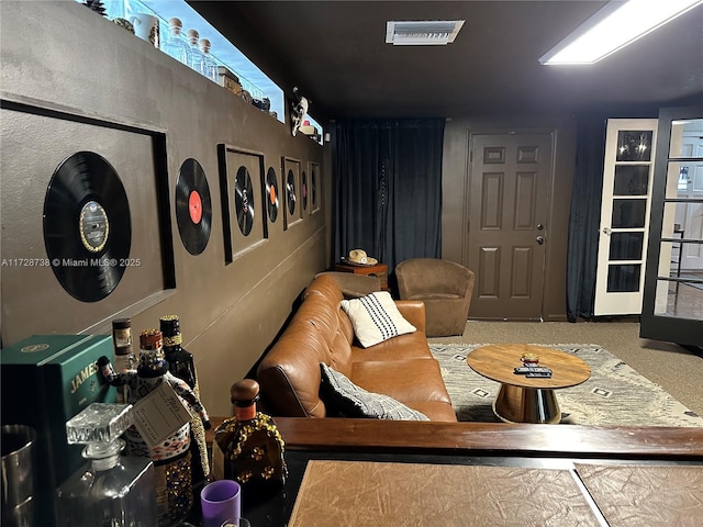 sitting room with carpet floors