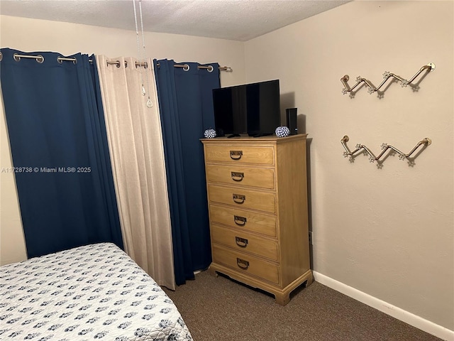 carpeted bedroom with a textured ceiling