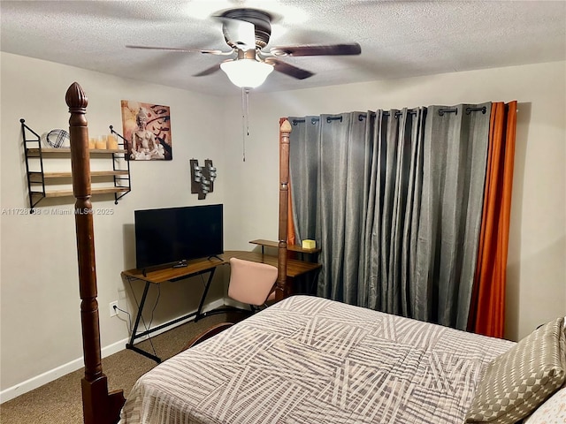 carpeted bedroom featuring a textured ceiling and ceiling fan