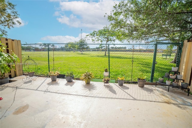 view of yard featuring a patio and a rural view