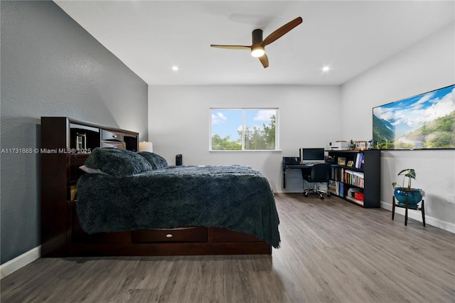 bedroom with hardwood / wood-style flooring and ceiling fan