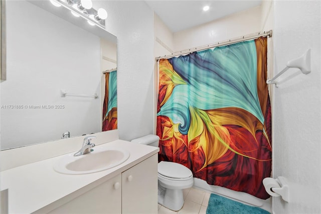 bathroom with vanity, toilet, and tile patterned flooring