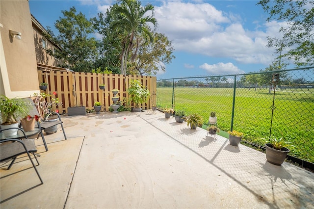 view of patio / terrace with a rural view