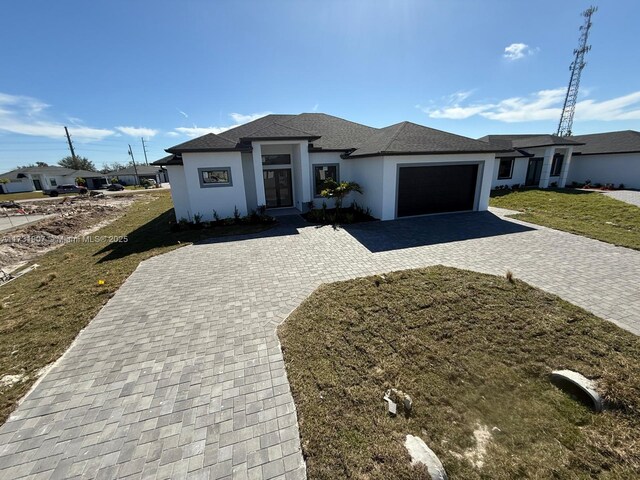 view of side of home with a garage and a yard