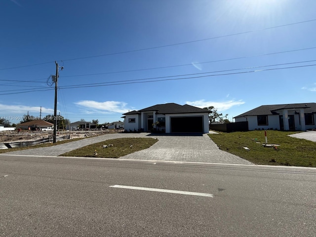 view of front facade with a garage and a front yard