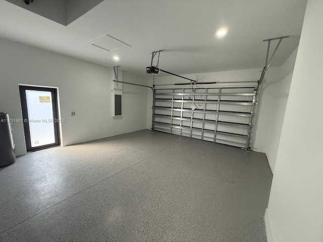 garage with a garage door opener, electric panel, and water heater