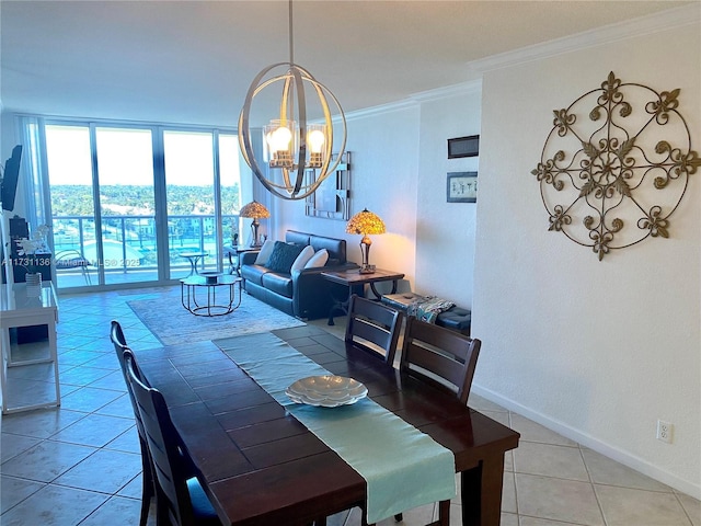 tiled dining space featuring an inviting chandelier, crown molding, and a wall of windows