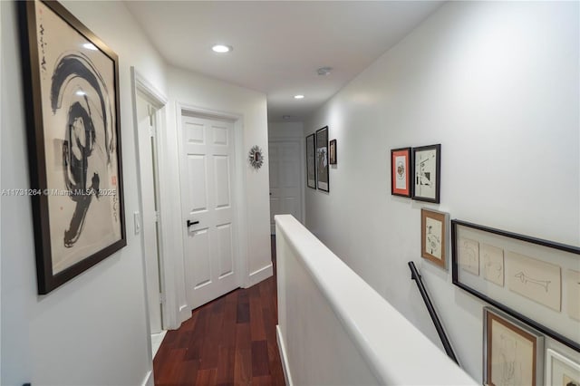 hallway with dark hardwood / wood-style floors