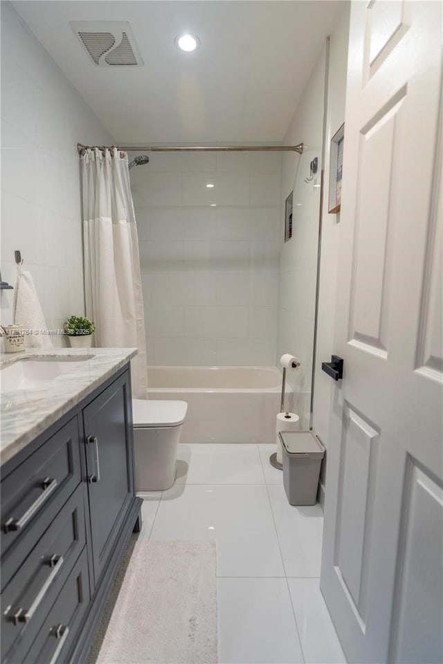 full bathroom with shower / tub combo with curtain, vanity, toilet, and tile patterned flooring