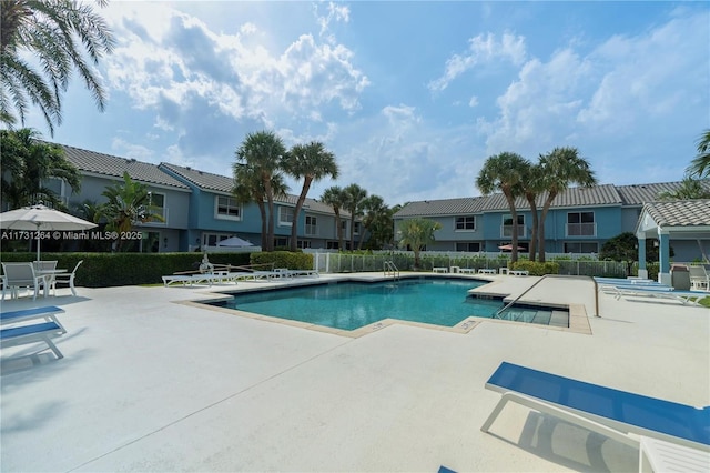 view of swimming pool with a patio