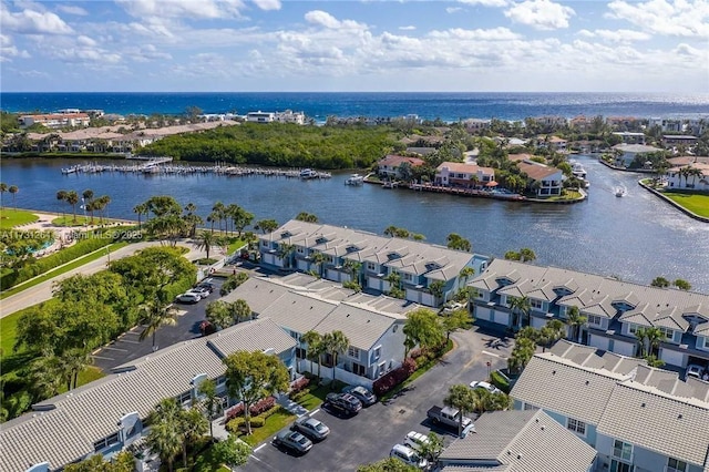 birds eye view of property featuring a water view