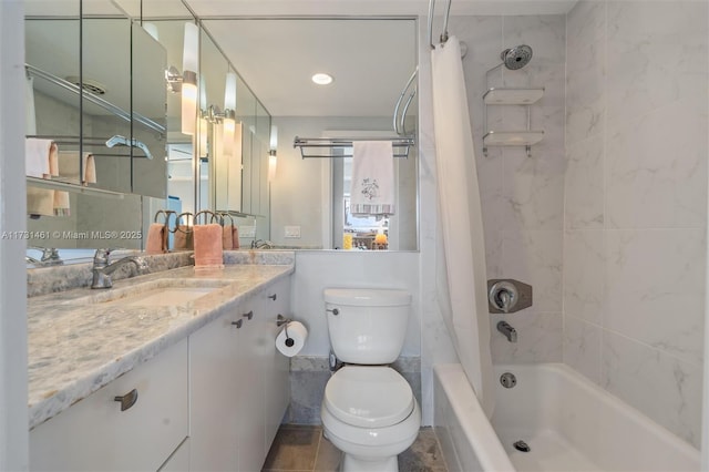 full bathroom with vanity, shower / tub combo with curtain, and toilet