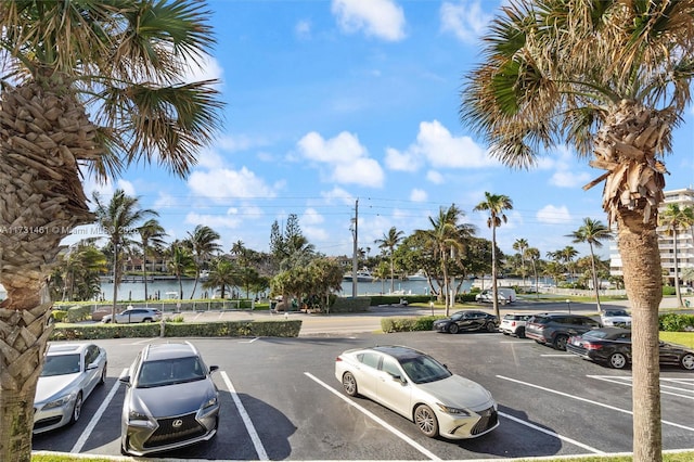 view of vehicle parking featuring a water view