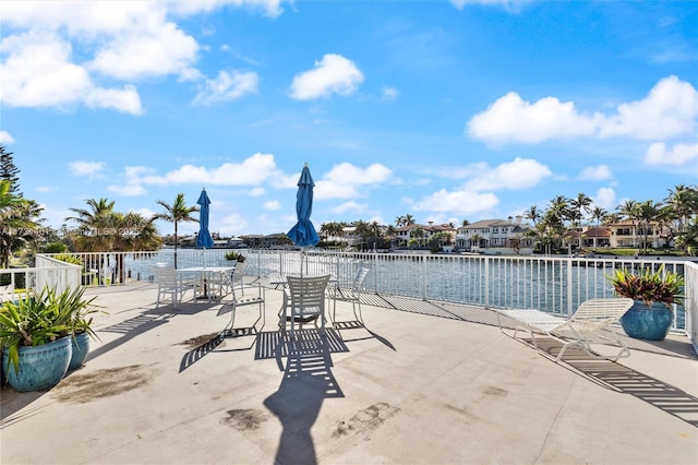 view of patio with a water view