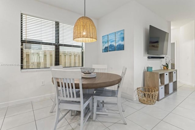 dining area featuring light tile patterned floors