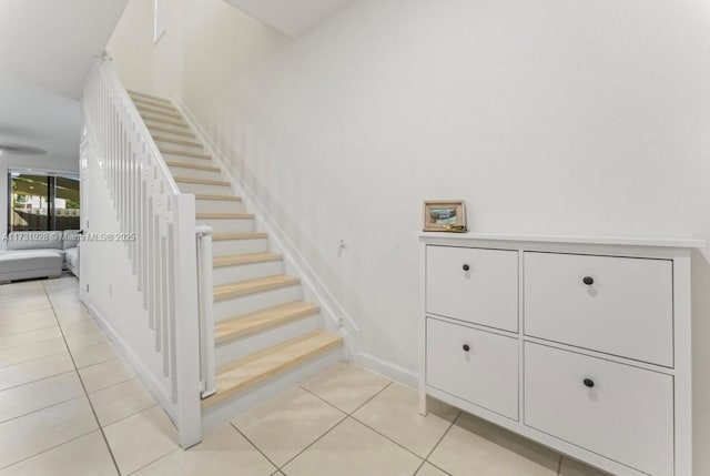 staircase with tile patterned floors