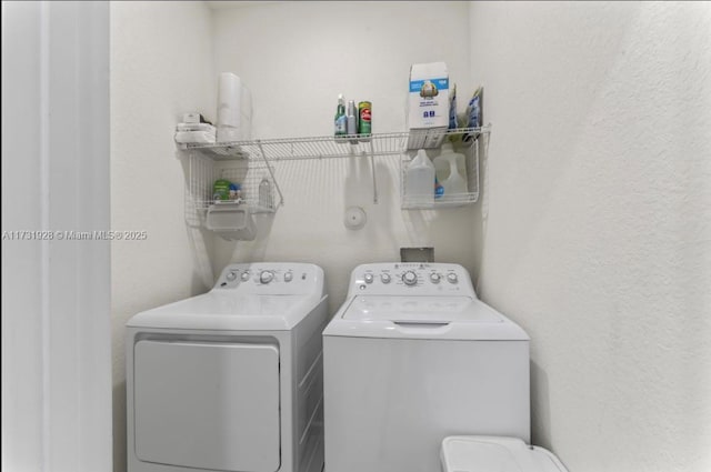 clothes washing area with independent washer and dryer