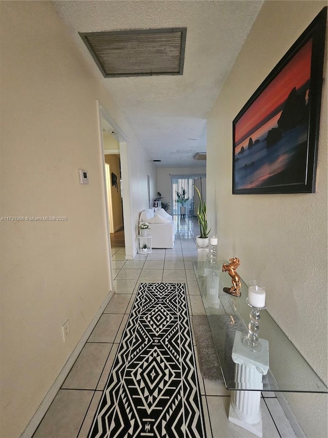 hall with light tile patterned flooring