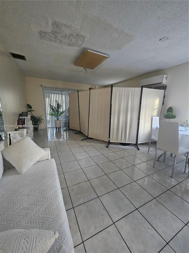 tiled living room with a wall unit AC