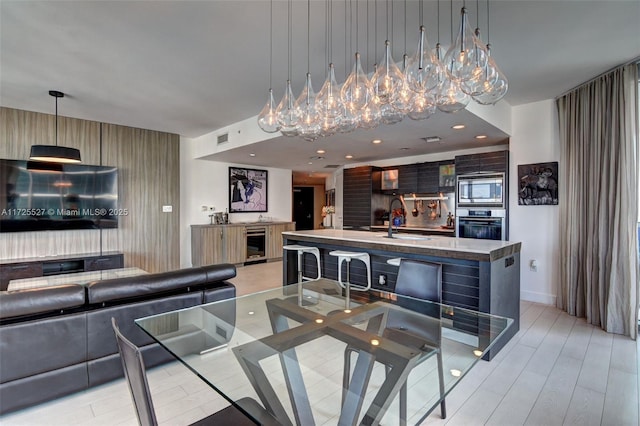 interior space with beverage cooler and sink