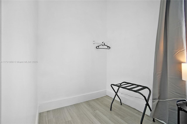 spacious closet featuring light hardwood / wood-style floors