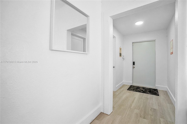 doorway with light hardwood / wood-style floors