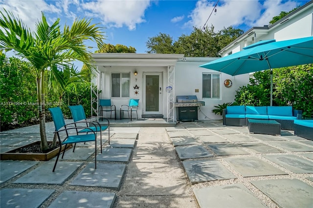 view of patio with a grill and an outdoor hangout area