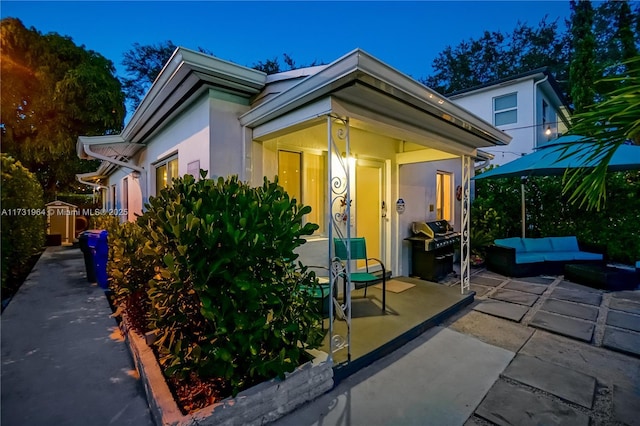 exterior space featuring an outdoor hangout area and a patio area