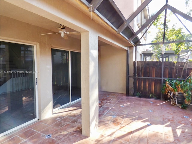 view of patio featuring ceiling fan