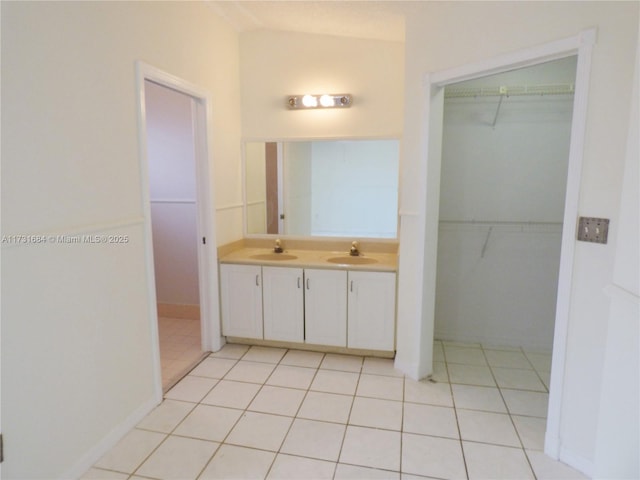 bathroom featuring tile patterned flooring and vanity