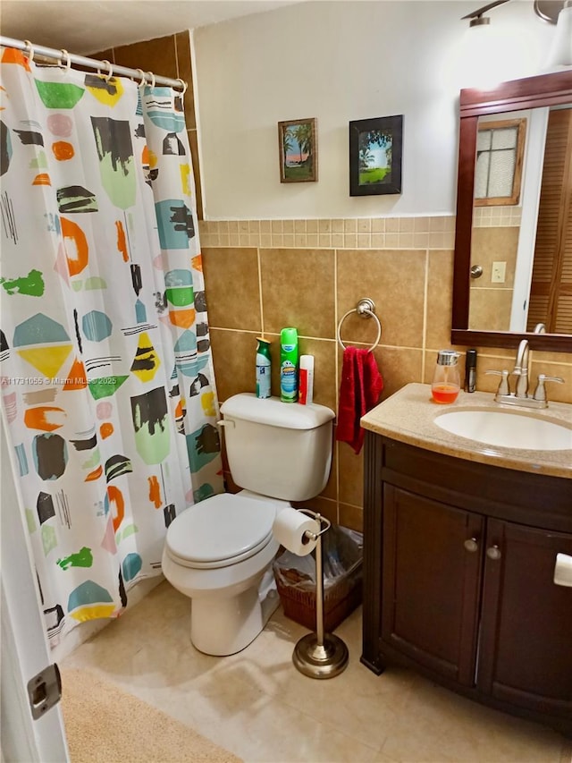 bathroom featuring vanity, tile walls, curtained shower, and toilet